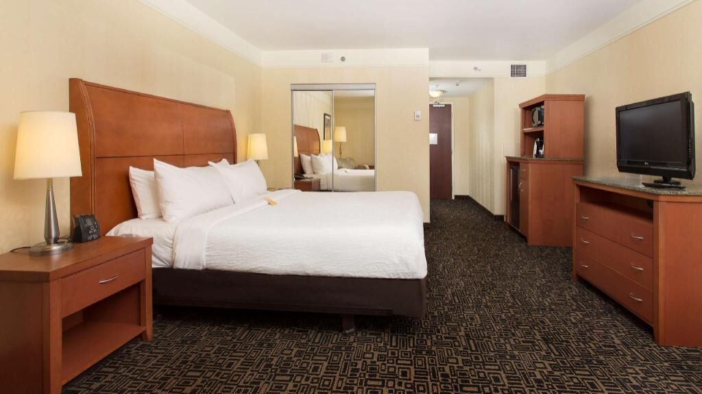 Premium bedding, in-room safe, laptop workspace, soundproofing