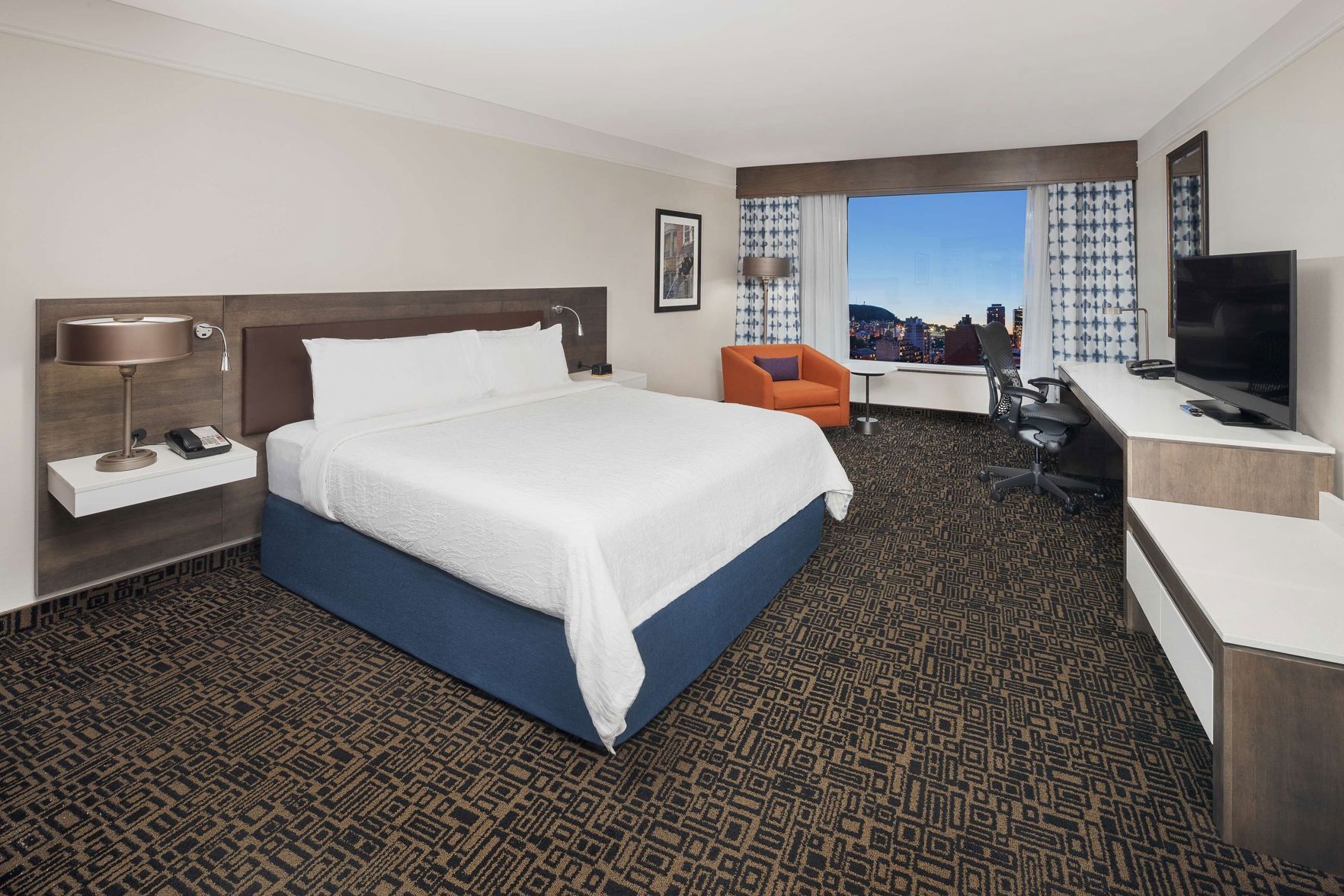 Premium bedding, in-room safe, laptop workspace, soundproofing