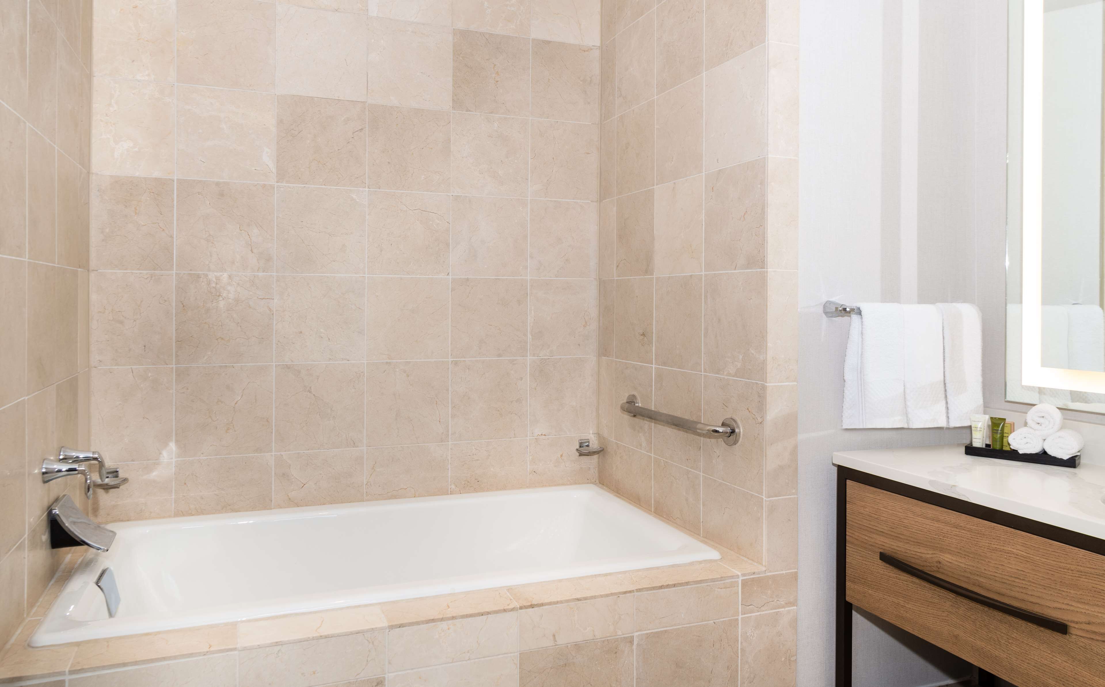 executive2- rooms suite,1 king bed with one sofabed,business lounge access | bathroom | designer toiletries, hair dryer, towels, soap