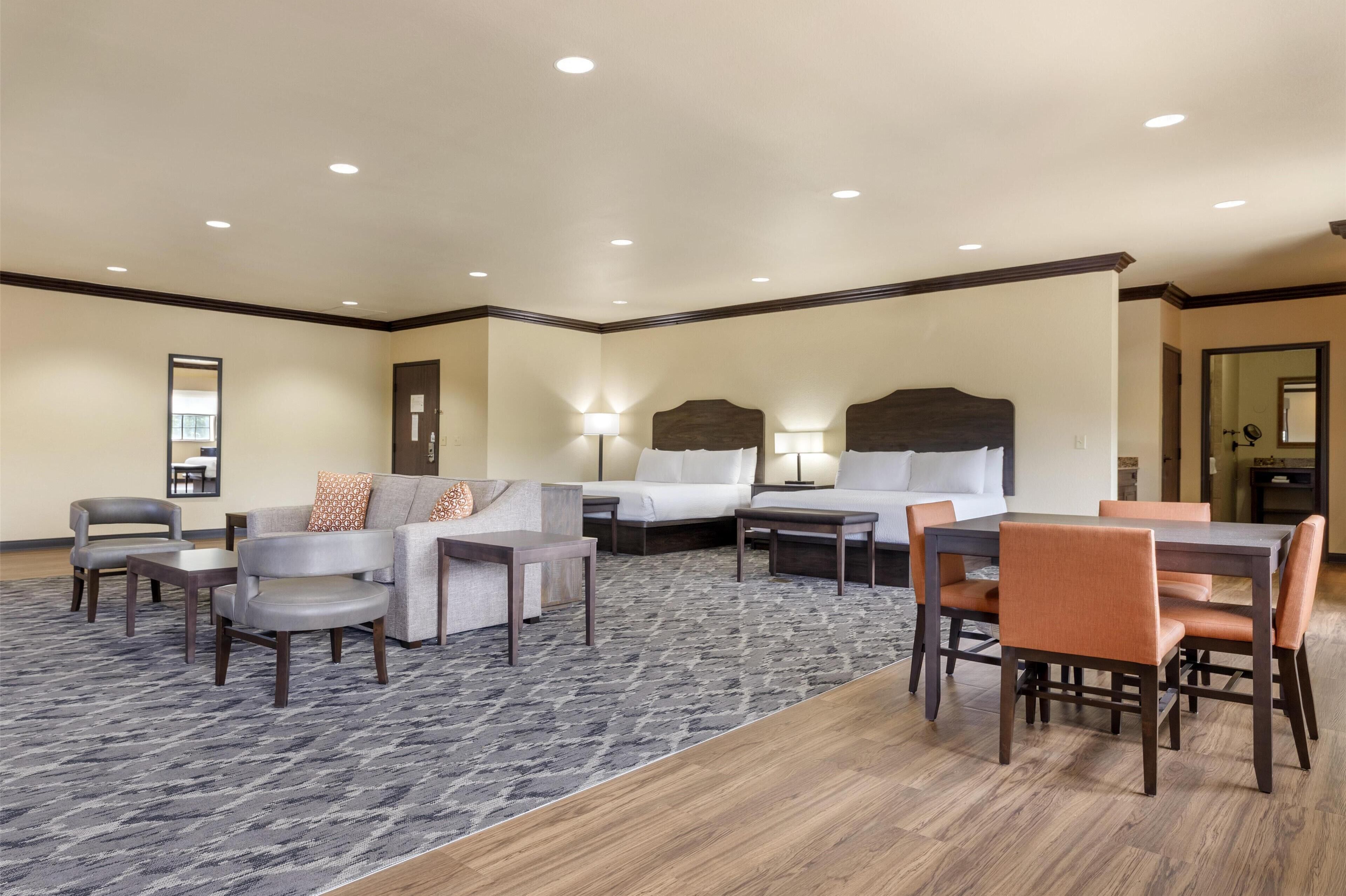 suite, 2 queen beds, non smoking, refrigerator & microwave (larger room;with sofabed) | 1 bedroom, in-room safe, desk, laptop workspace