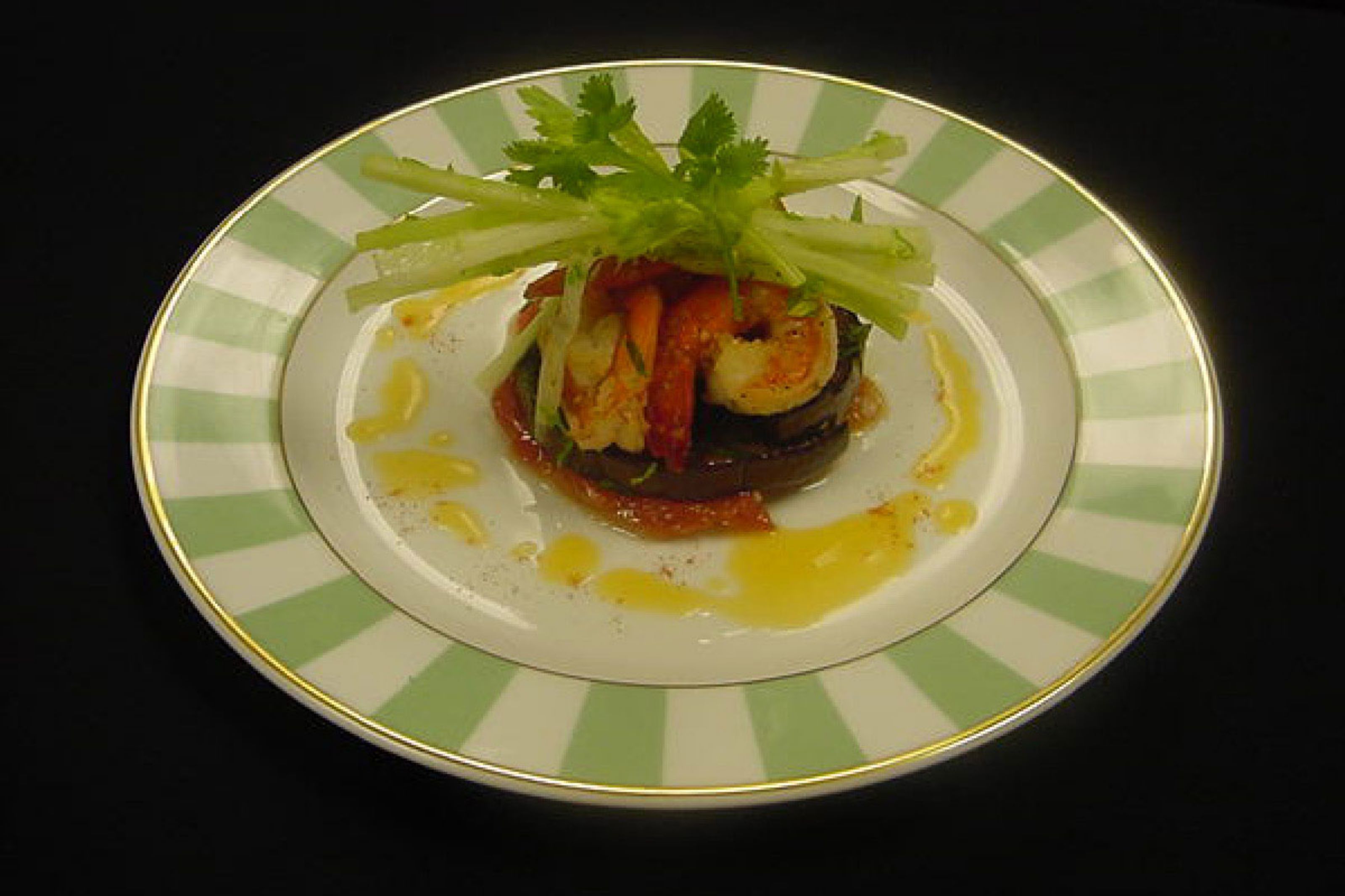 A plate with food on a striped plate.