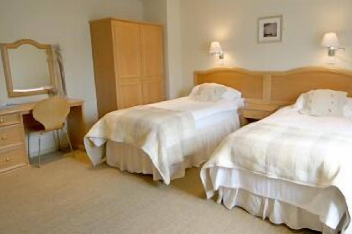 Double or Twin Room | Desk, blackout drapes, iron/ironing board (on request), WiFi (free)