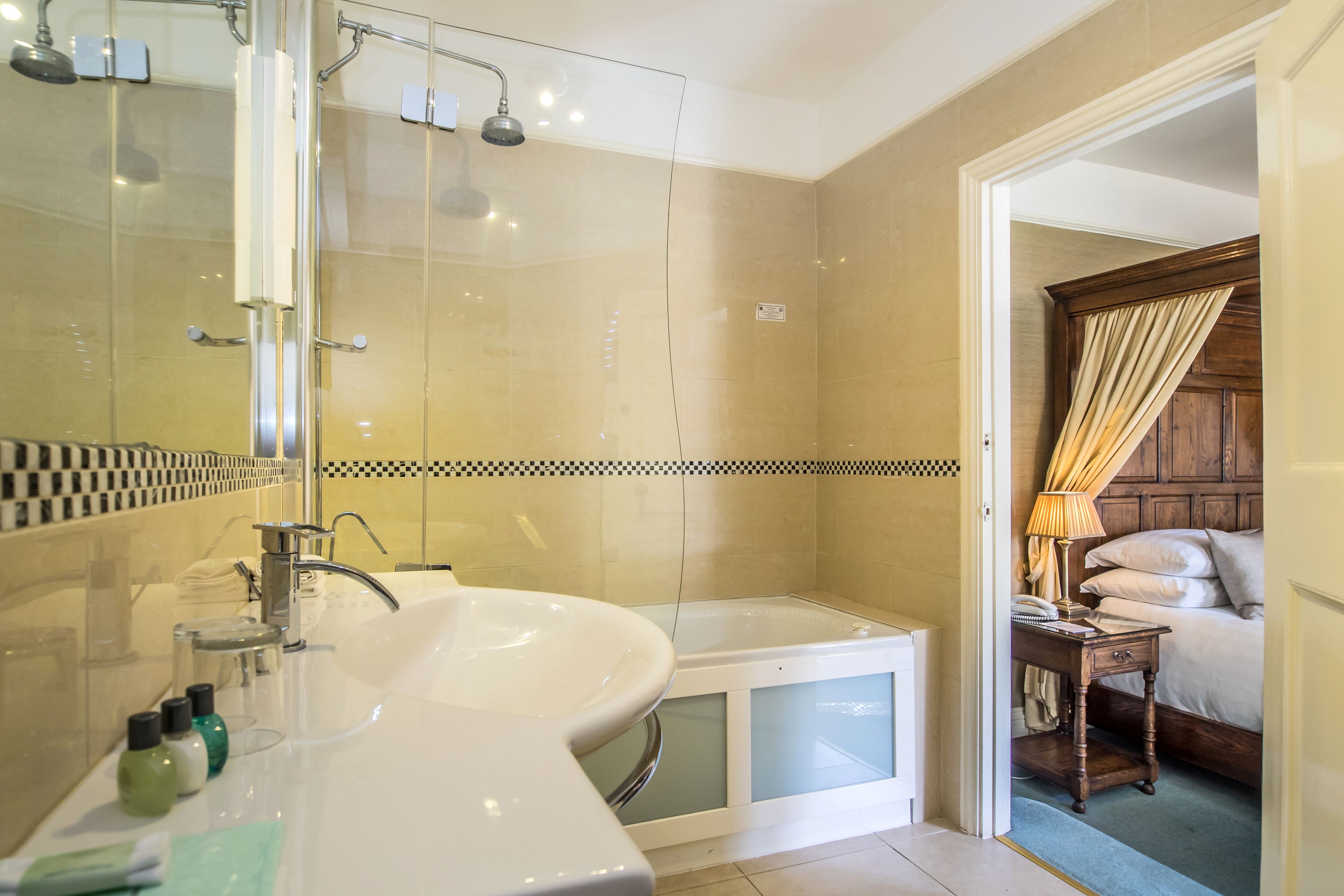deluxe room, 1 king bed | bathroom | designer toiletries, hair dryer, bathrobes, towels