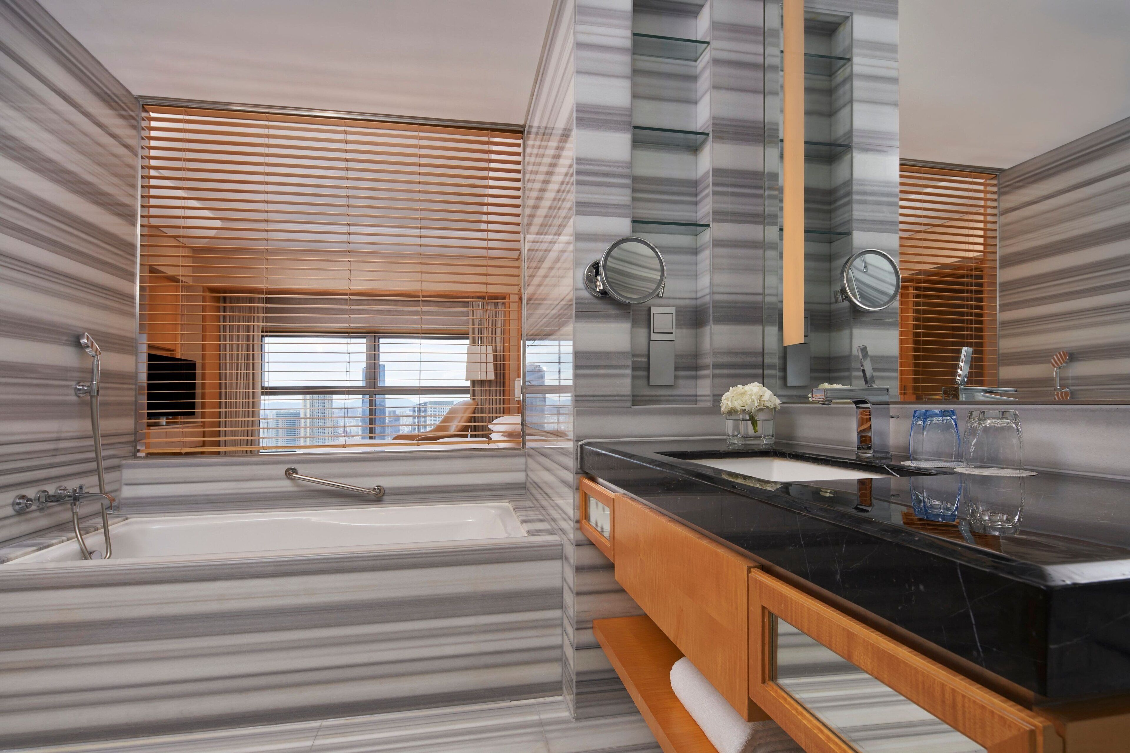 separate bathtub and shower, deep-soaking bathtub, rainfall showerhead