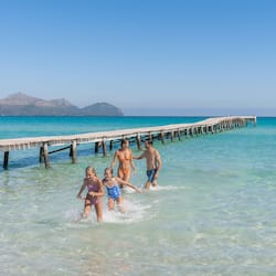 Walk along the pier and enjoy the tranquil atmosphere of this serene coastal location.