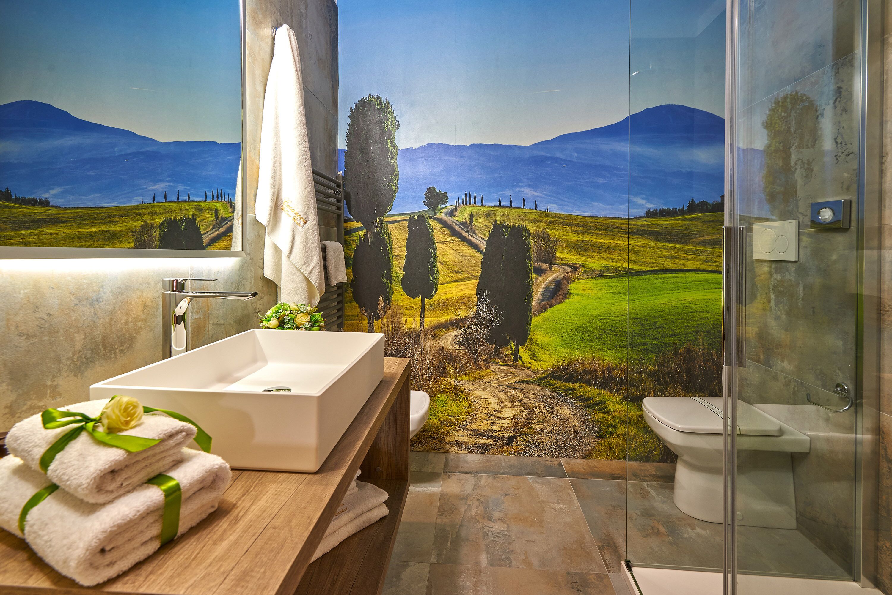 junior suite | bathroom | shower, rainfall showerhead, hair dryer, bathrobes