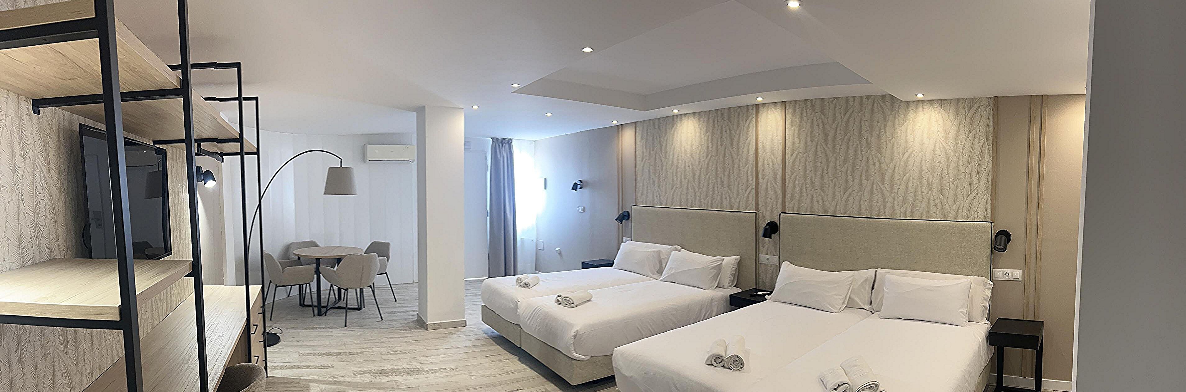 Deluxe Quadruple Room with Free Airport Shuttle | Down comforters, minibar, in-room safe, individually decorated