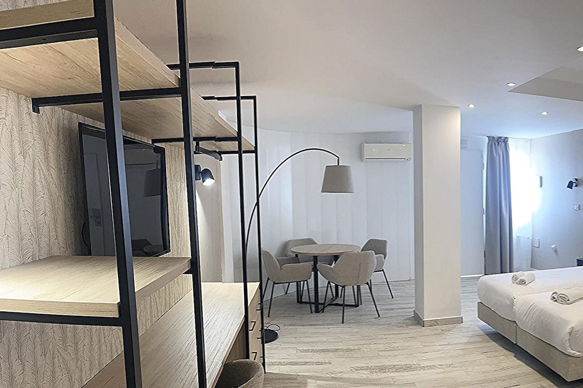Deluxe Quadruple Room with Free Airport Shuttle | Minibar, in-room safe, individually decorated, individually furnished