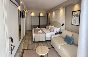 Comfort Quadruple Room with Free Airport Shuttle | Down comforters, minibar, in-room safe, individually decorated