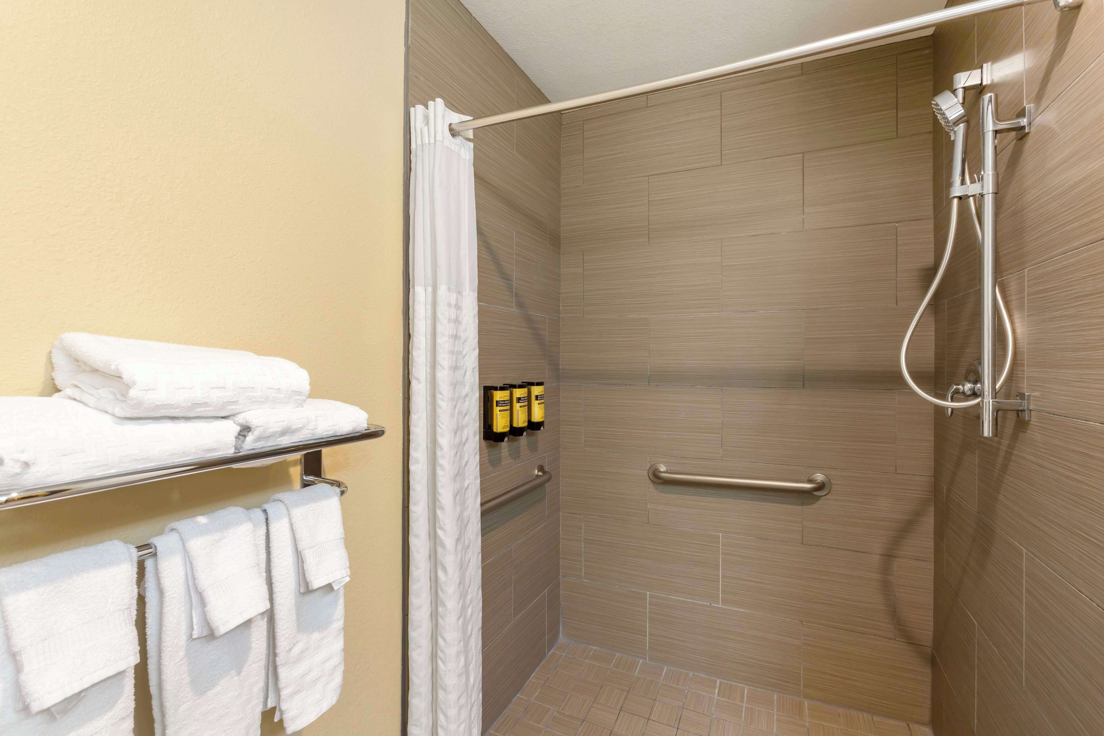 standard room, 2 queen beds, accessible, refrigerator & microwave | bathroom | shower, hair dryer, towels