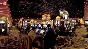 A casino with slot machines, blackjack tables, and a vibrant, patterned carpet. - Kewadin Casinos St. Ignace Hotel (St Ignace)