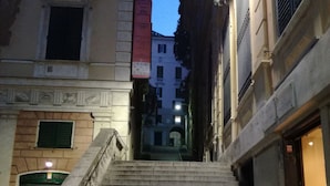 A staircase leading up to a building with a sign that reads "Palazzo Merici." - Hotel Cairoli (Genoa)