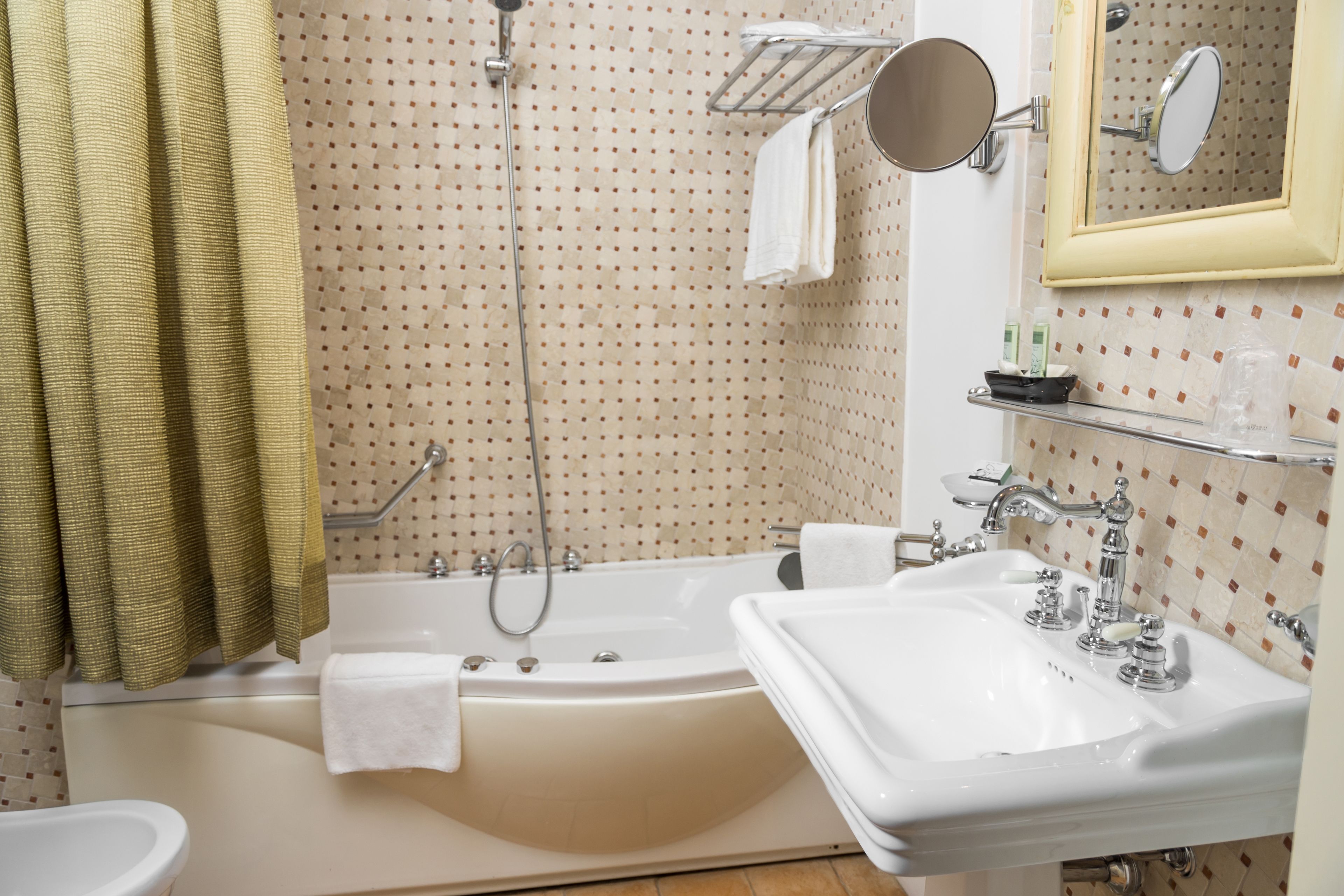 combined shower/bathtub, designer toiletries, hair dryer, bidet