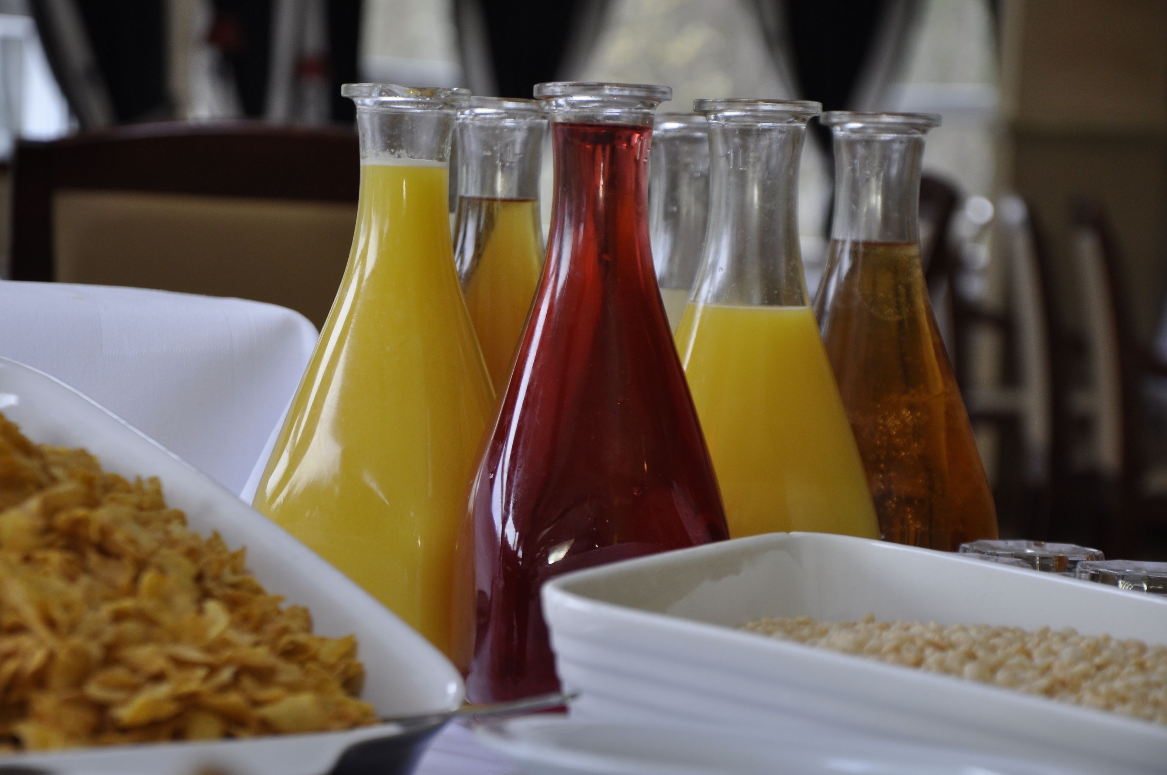 A breakfast buffet with various food items and beverages.