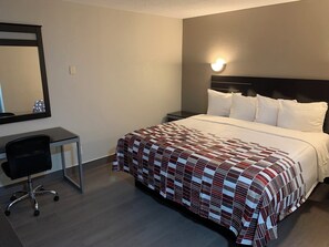 Desk, laptop workspace, blackout drapes, iron/ironing board