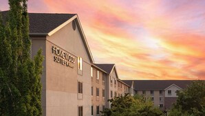 A hotel named "Homewood Suites by Hilton" with a modern architectural design, featuring a prominent entrance and multiple windows. - Homewood Suites Medford (Medford)