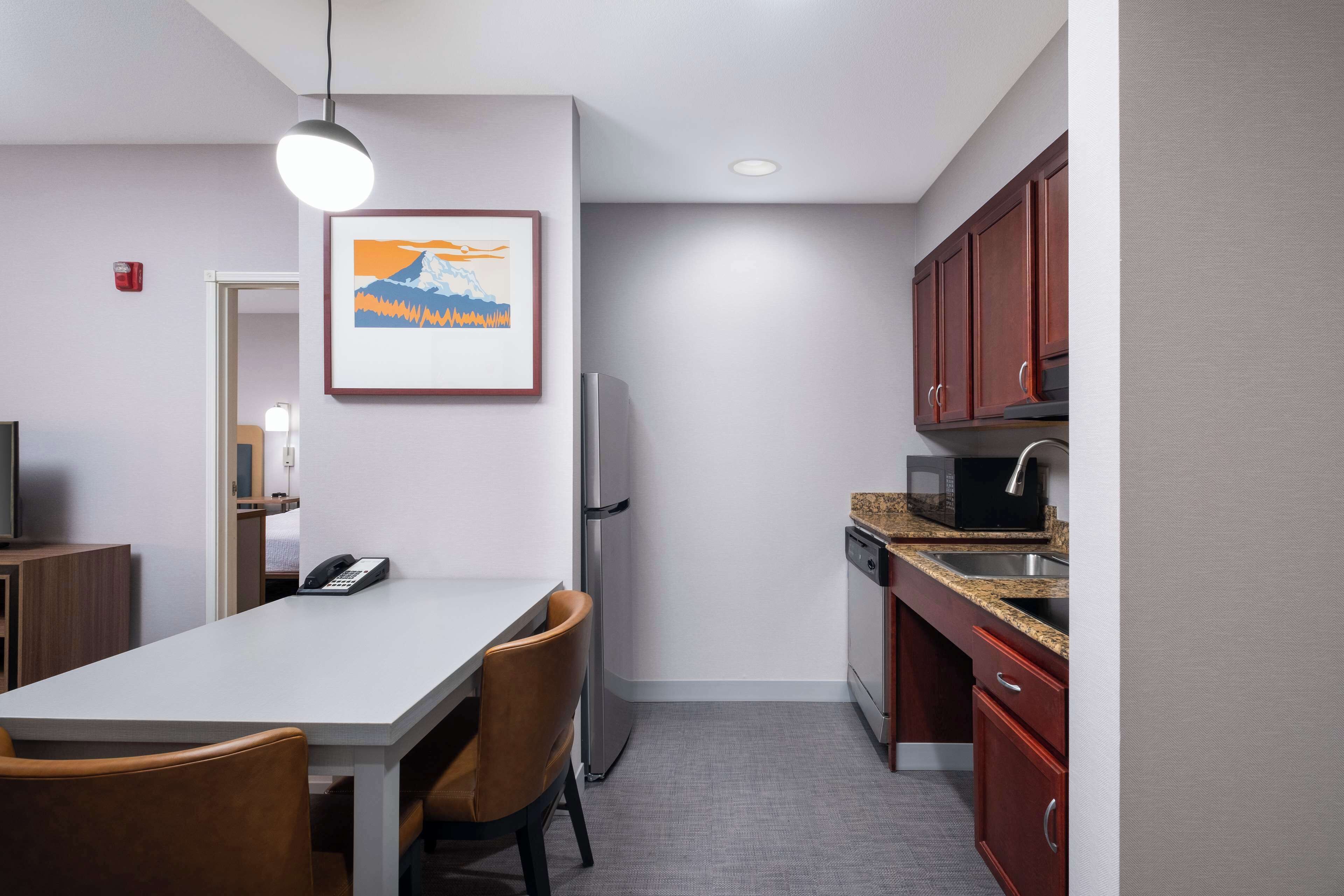 full-sized fridge, microwave, stovetop, dishwasher