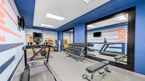 A gym with treadmills, dumbbells, and a mirrored wall. - Hampton Inn Harrison (Harrison)