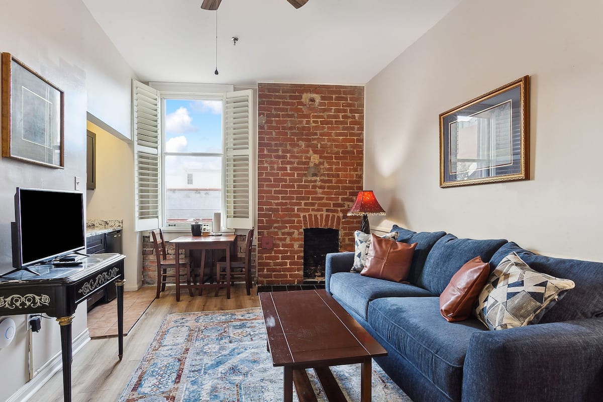 One Bedroom Suite | Living area | 40-inch flat-screen TV with cable channels, TV