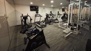 A gym with various exercise equipment, including treadmills, stationary bikes, and weight machines. - Holiday Inn Express Mexico Santa Fe by IHG (Mexico City)