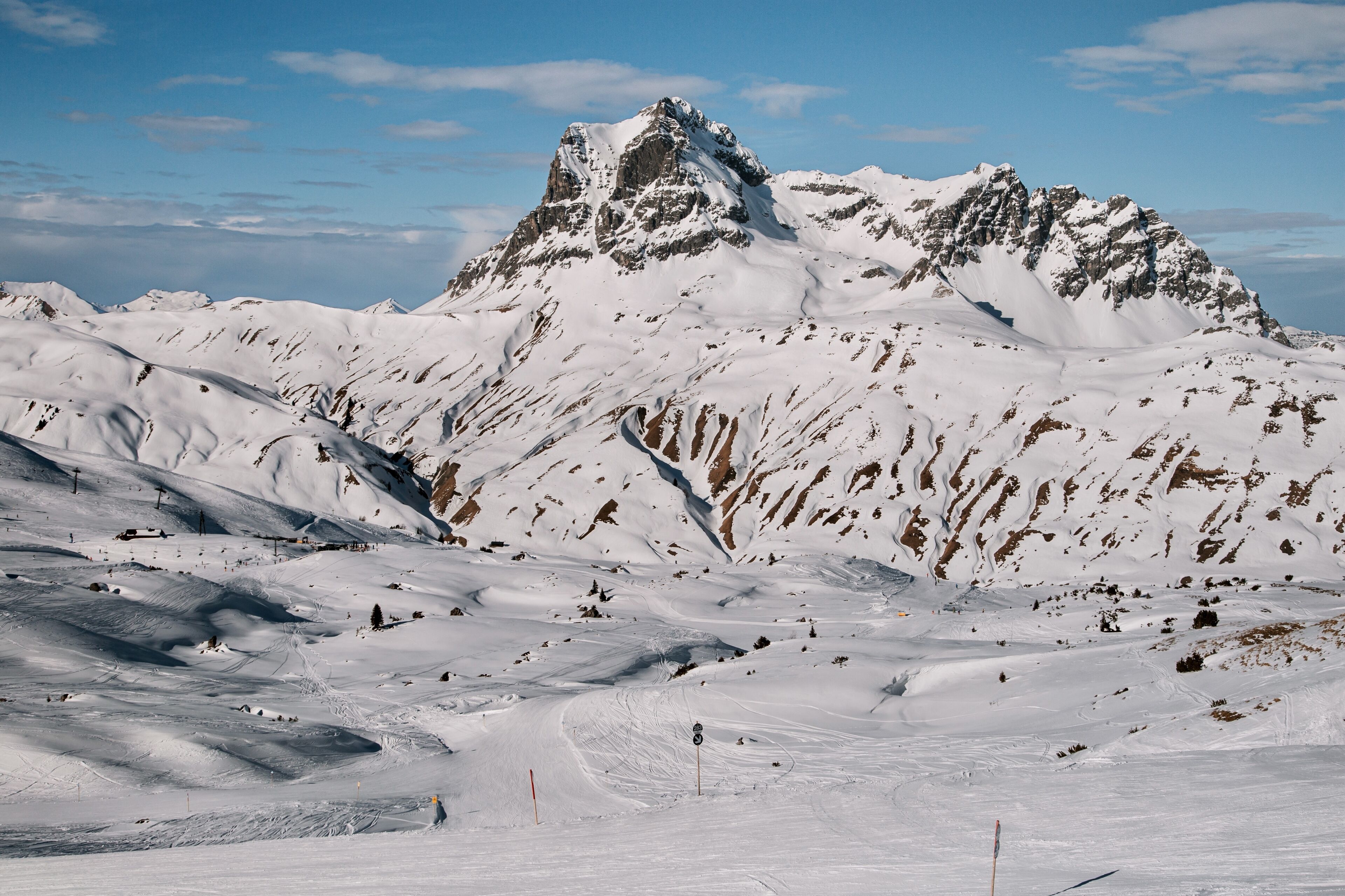 A snow-covered mountain with a ski slope.