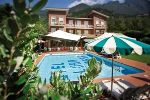 Outdoor pool, open 8 AM to 7 PM, pool umbrellas, pool loungers