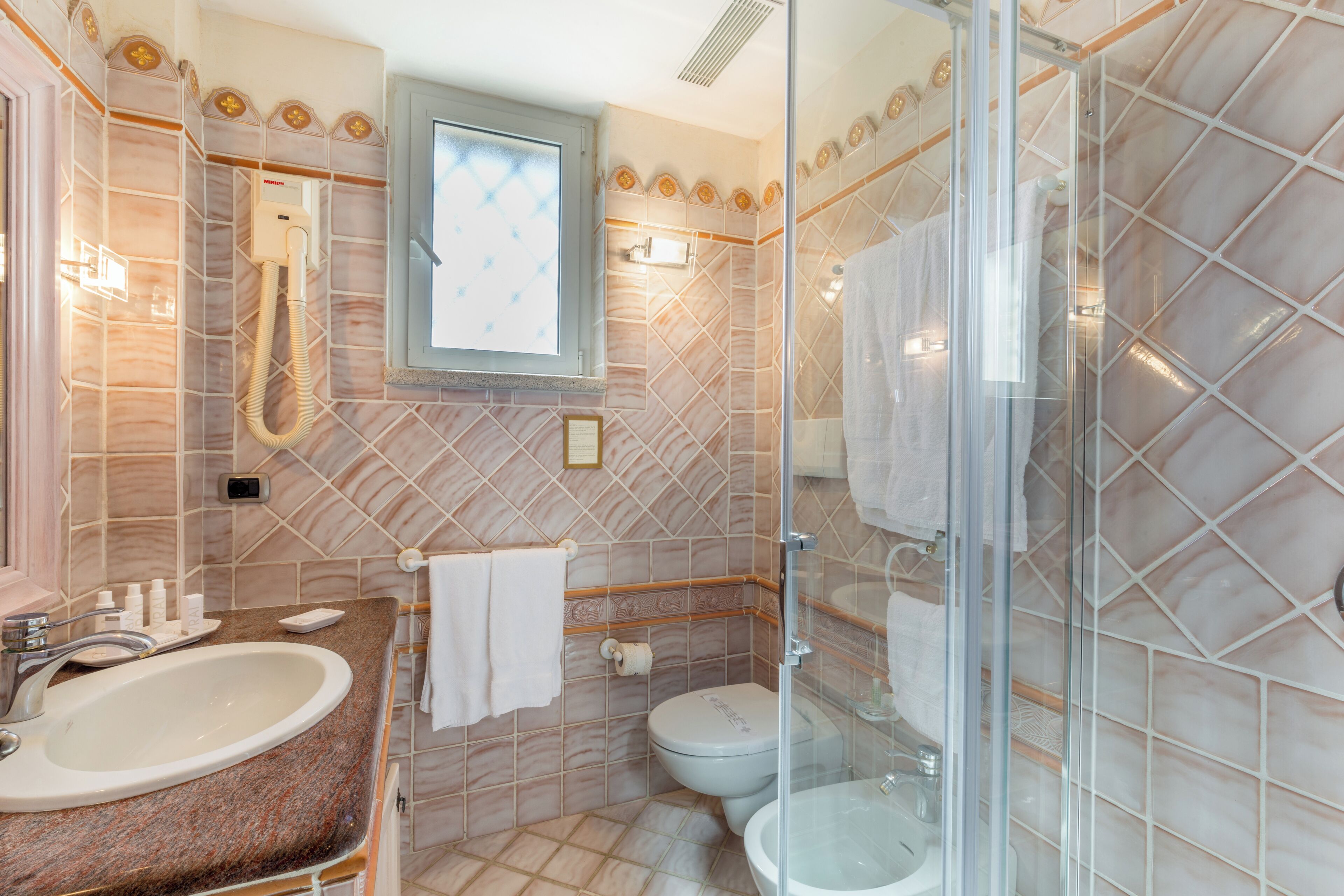 shower, designer toiletries, hair dryer, slippers