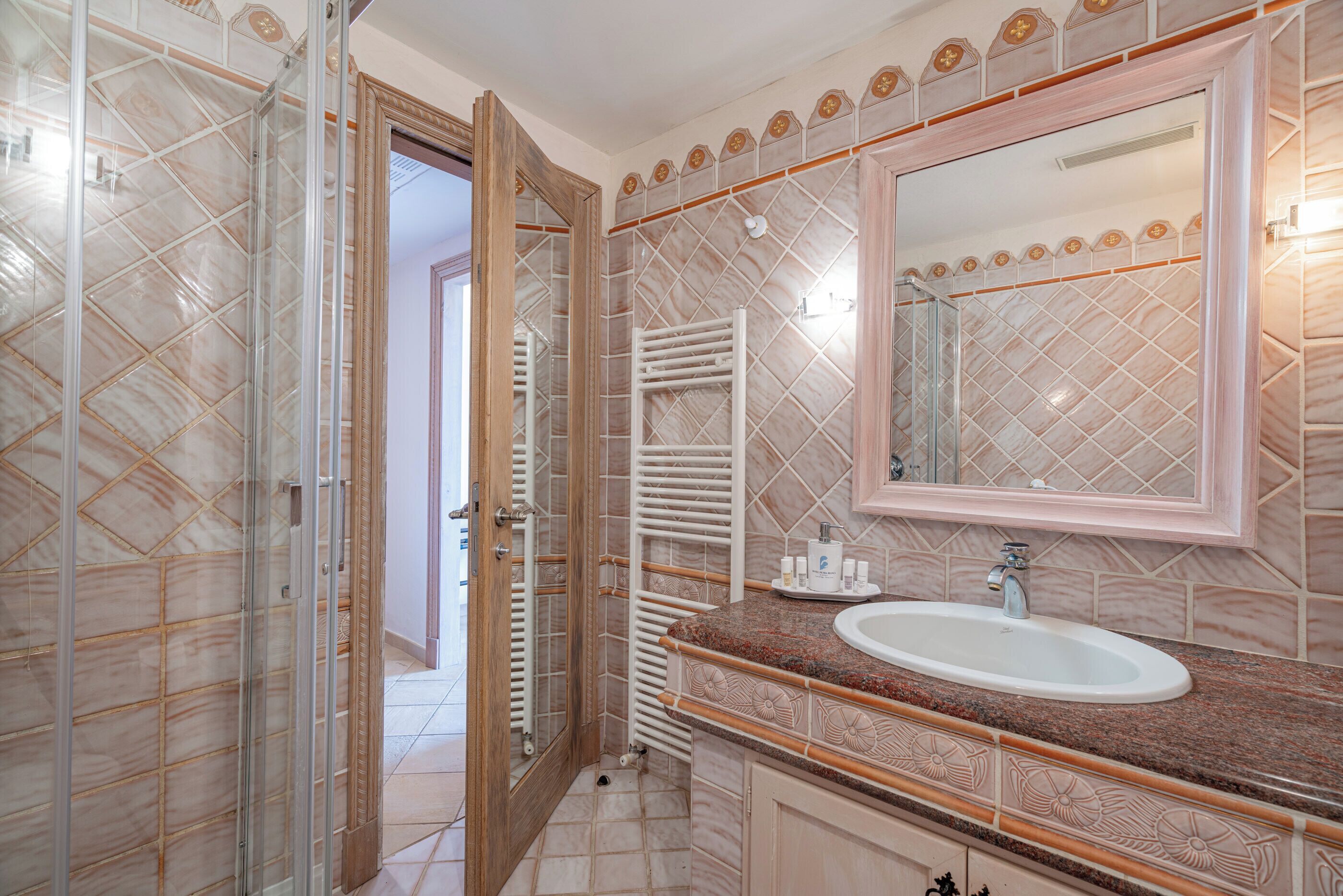 shower, designer toiletries, hair dryer, slippers