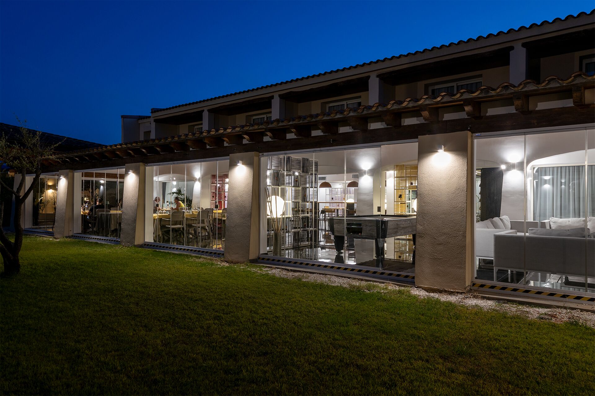 A modern house with a dining area, kitchen, and living room.
