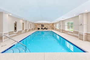 A large indoor swimming pool with a tiled floor, surrounded by walls with a light wood finish, and a ceiling with recessed lighting. - Country Inn & Suites by Radisson, Pensacola West, FL (Pensacola)