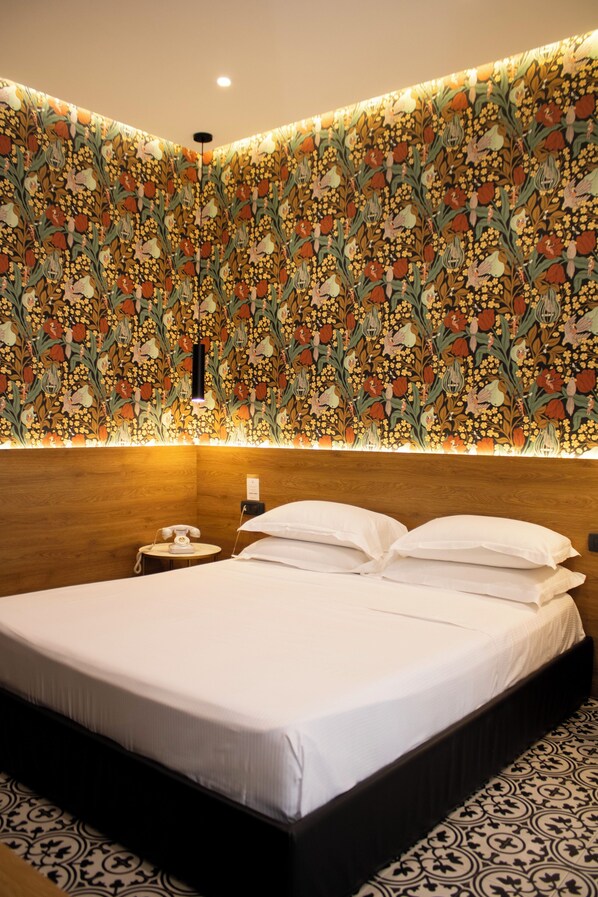 Suite, Balcony | 2 bedrooms, down comforters, individually decorated