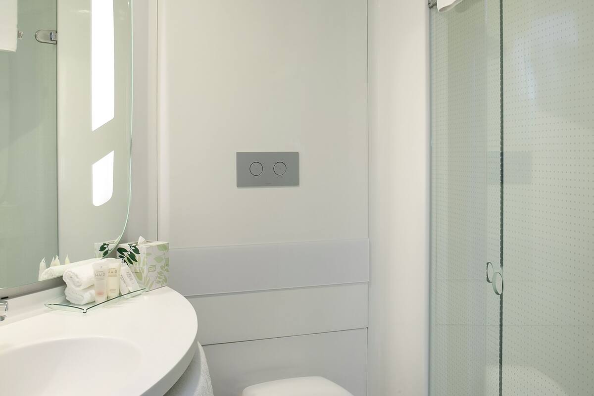 room, multiple beds | bathroom | shower, eco-friendly toiletries, hair dryer, towels