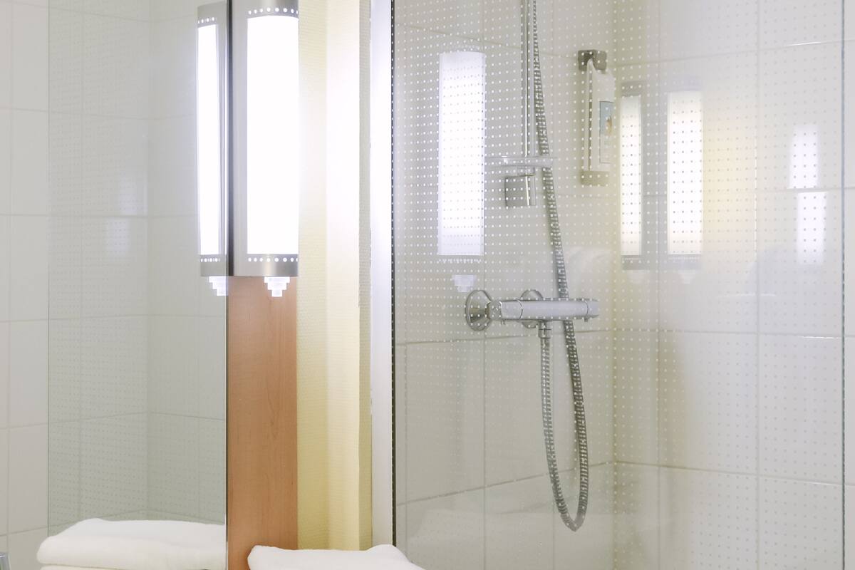 shower, eco-friendly toiletries, hair dryer, towels