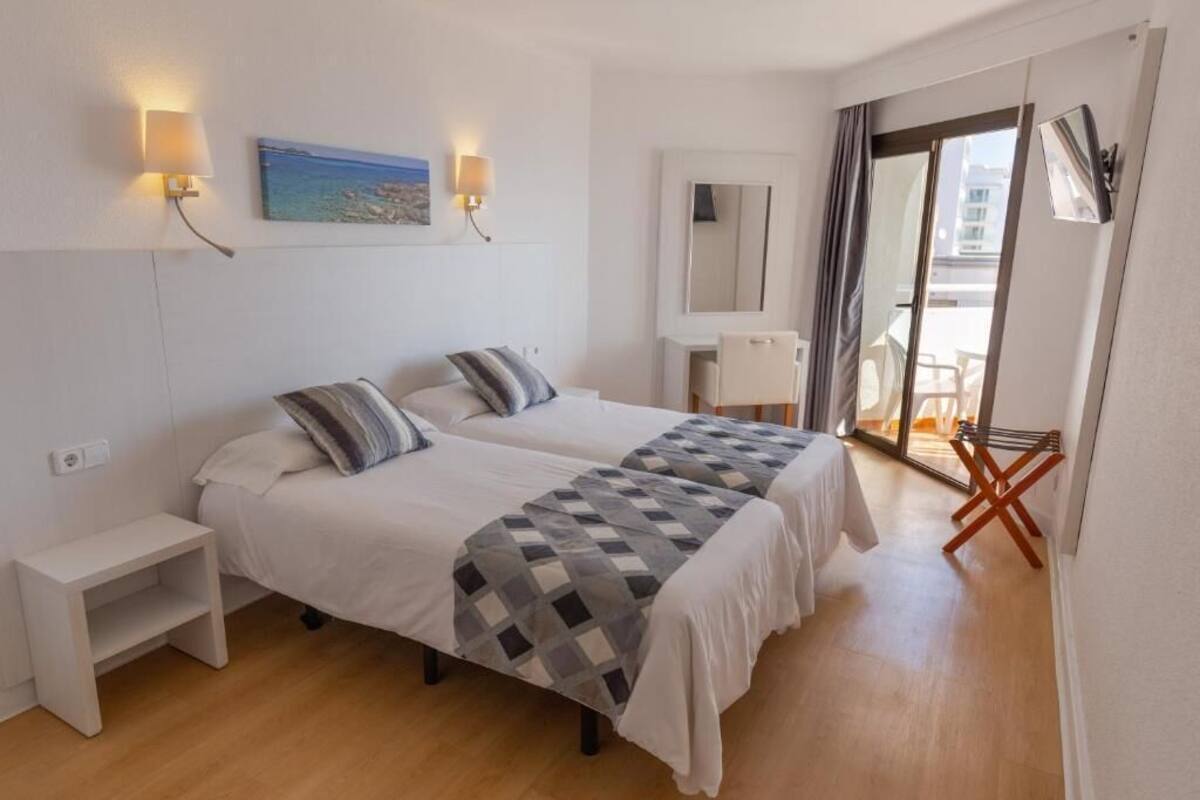 Desk, blackout drapes, WiFi (surcharge), bed sheets