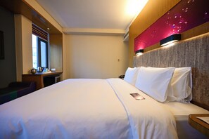 A hotel room with a large bed, a desk with a computer, and a window. - Aloft Beijing, Haidian (Beijing)