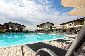 Seasonal outdoor pool, open 9:00 AM to 7:00 PM, sun loungers