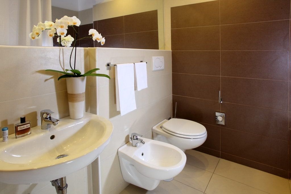 superior double room | bathroom | shower, rainfall showerhead, hair dryer, towels