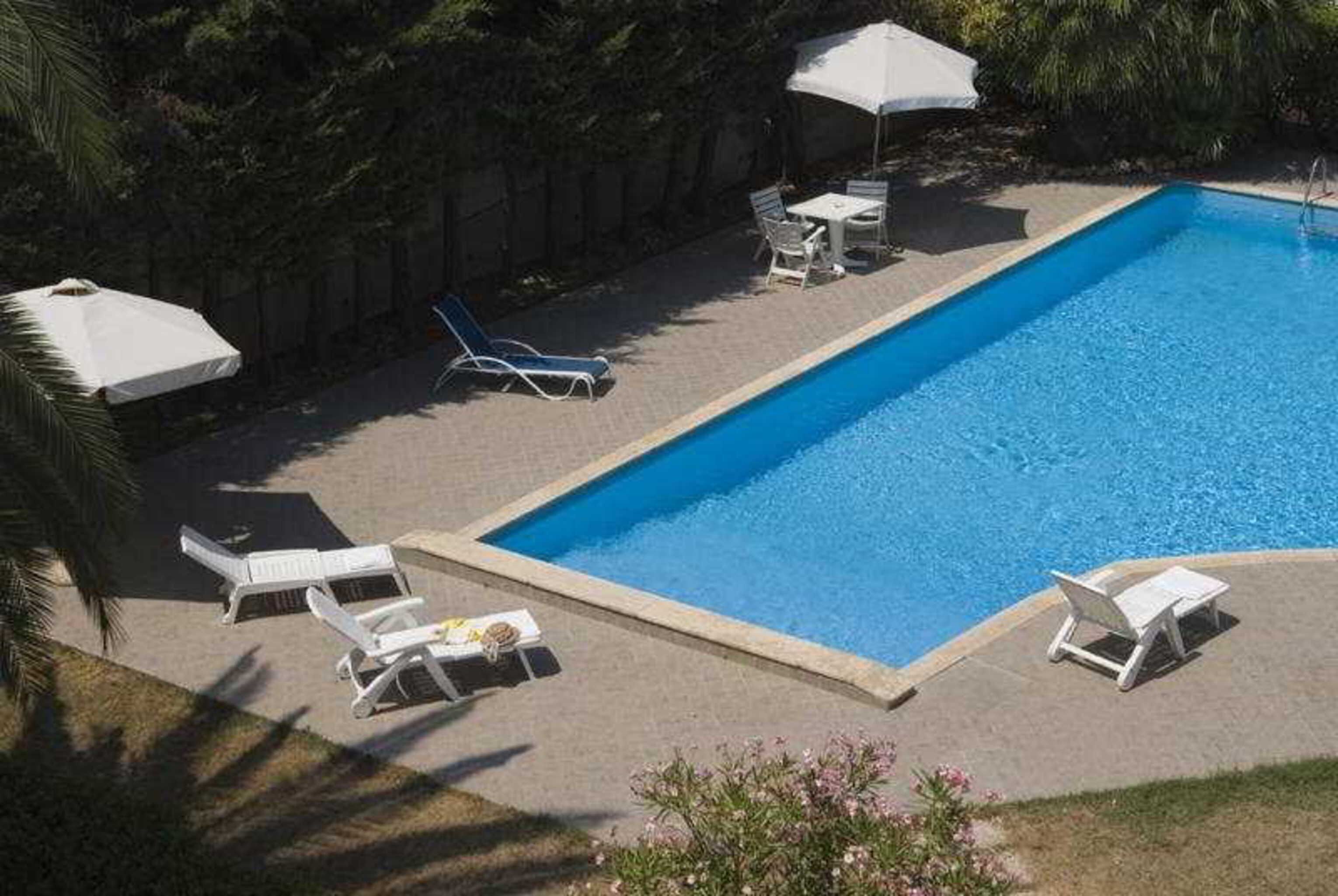 indoor pool, outdoor pool, pool umbrellas