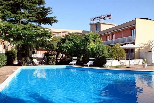 Indoor pool, outdoor pool, pool umbrellas