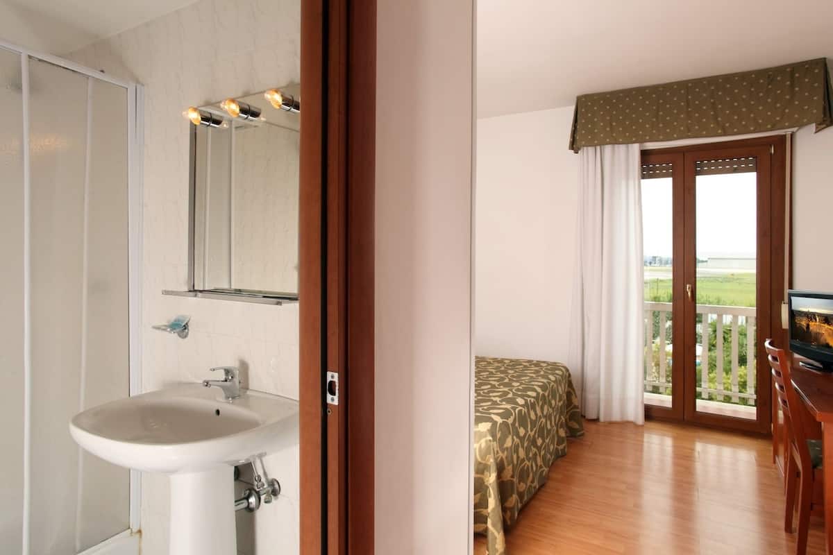 Shower, rainfall showerhead, hair dryer, towels