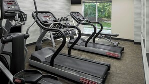 A gym with treadmills, ellipticals, and dumbbells. - Fairfield Inn & Suites by Marriott Carlisle (Carlisle)