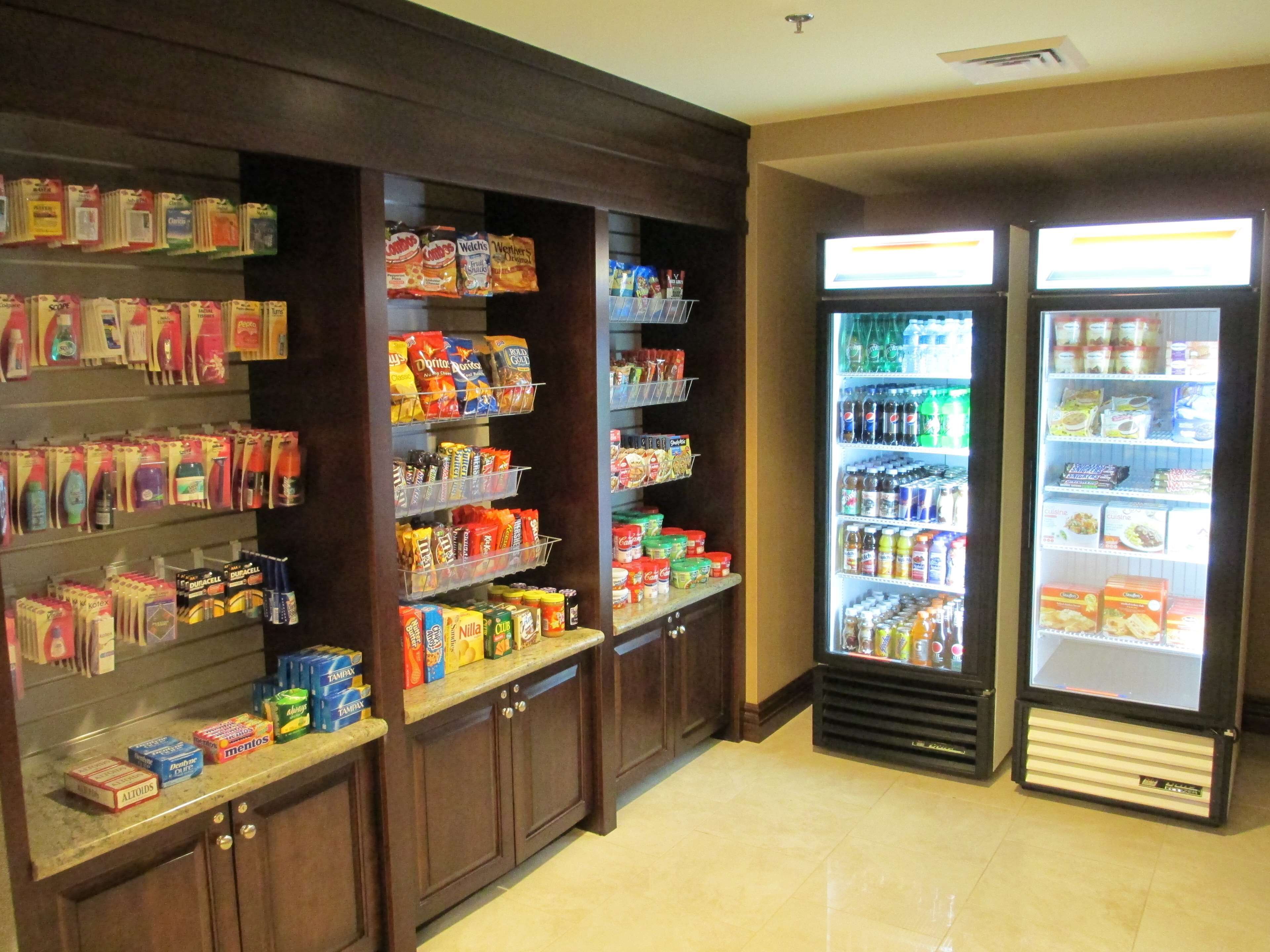 A self-service kiosk with snacks, beverages, and toiletries.