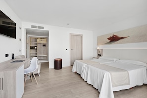 A modern hotel room with a bed, desk, chair, and a large artwork on the wall. - THB Cala Lliteras Hotel - Adults Only (Capdepera)