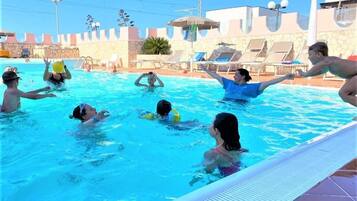 Seasonal outdoor pool, pool umbrellas, sun loungers