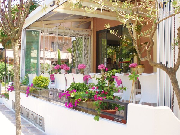 Breakfast, lunch, dinner served; local cuisine 