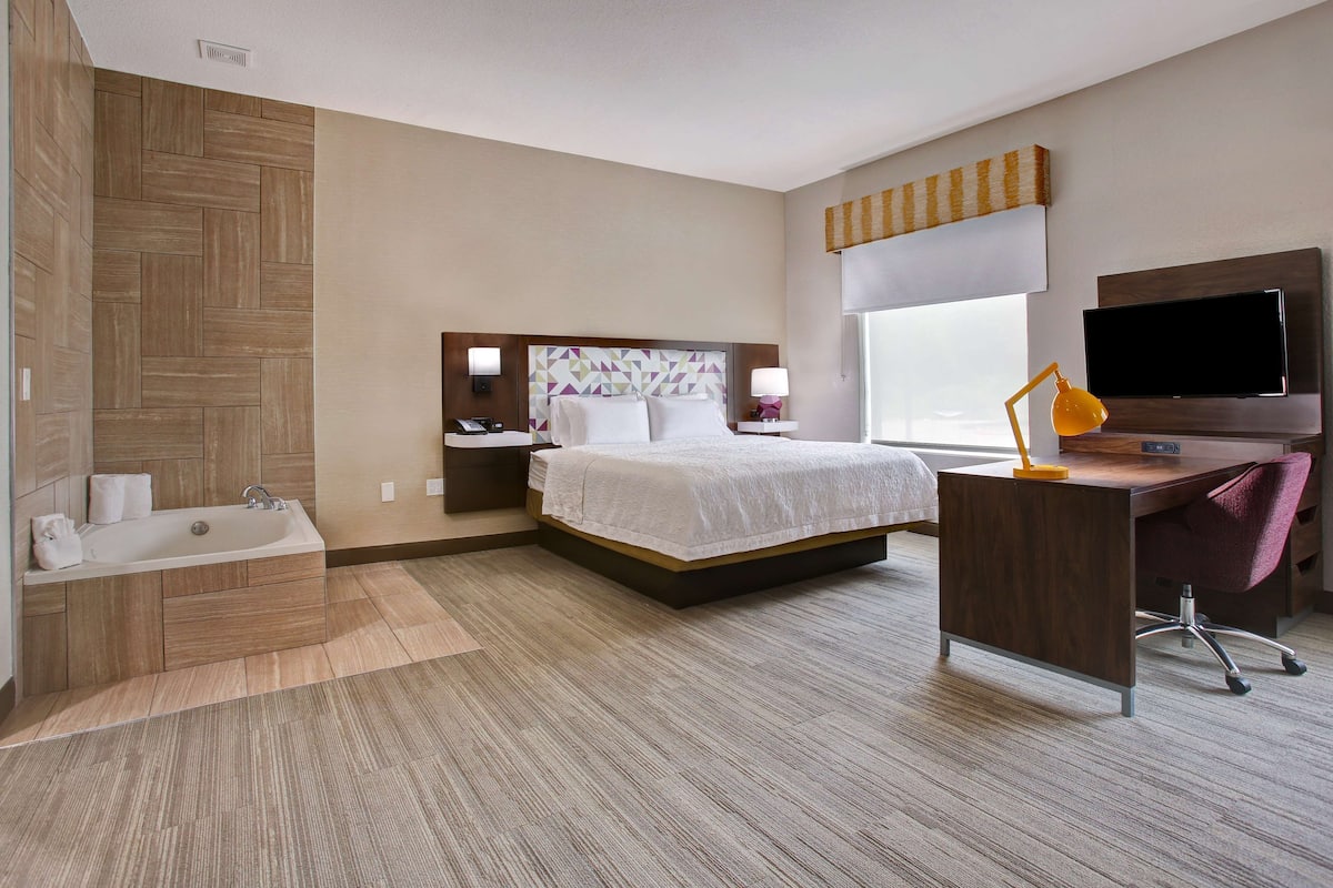 suite, 1 king bed, non smoking | in-room safe, iron/ironing board, free cots/infant beds, rollaway beds