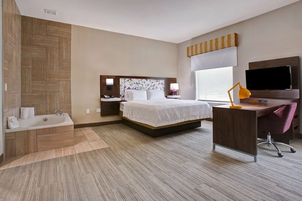 Suite, 1 King Bed, Non Smoking | In-room safe, iron/ironing board, free cribs/infant beds, rollaway beds