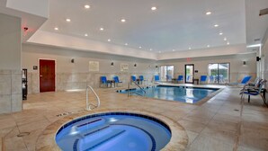 A swimming pool with a hot tub, blue chairs, and a no lifeguard sign. - Hampton Inn & Suites Dallas-DeSoto (DeSoto)
