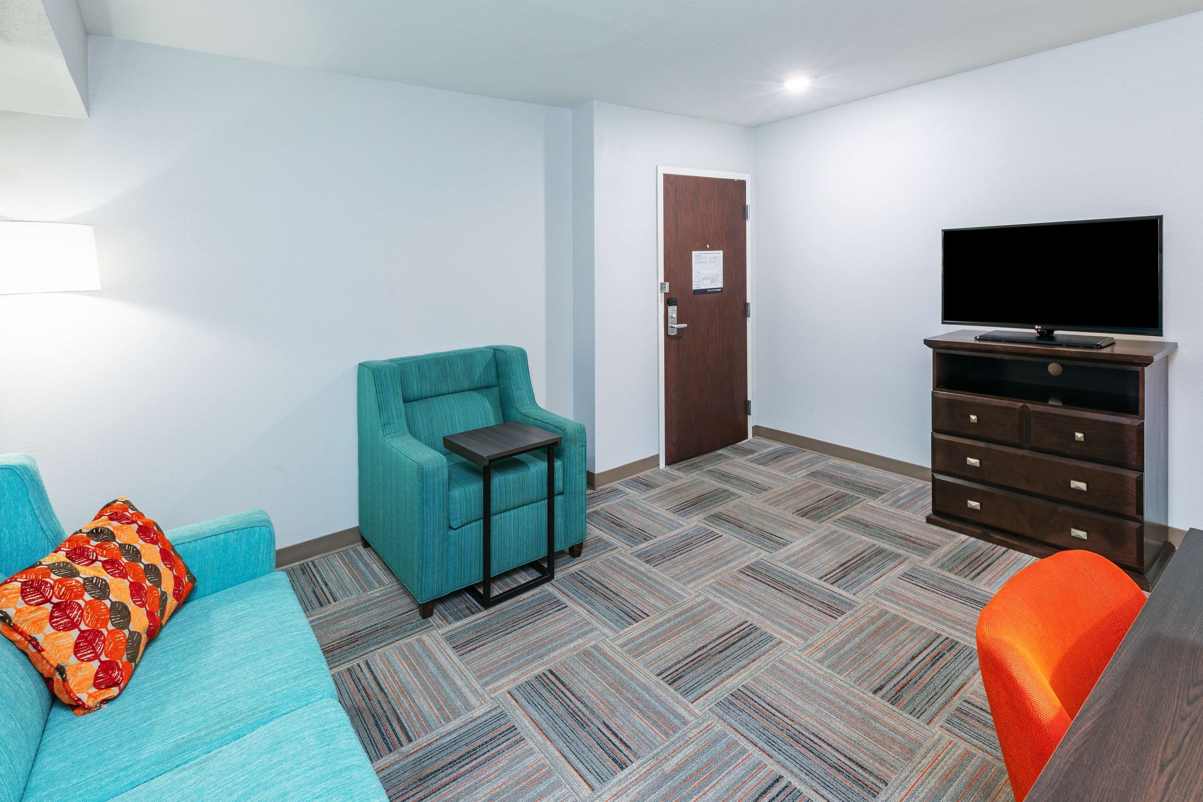 suite one king sofabed non smoking | living area | tv