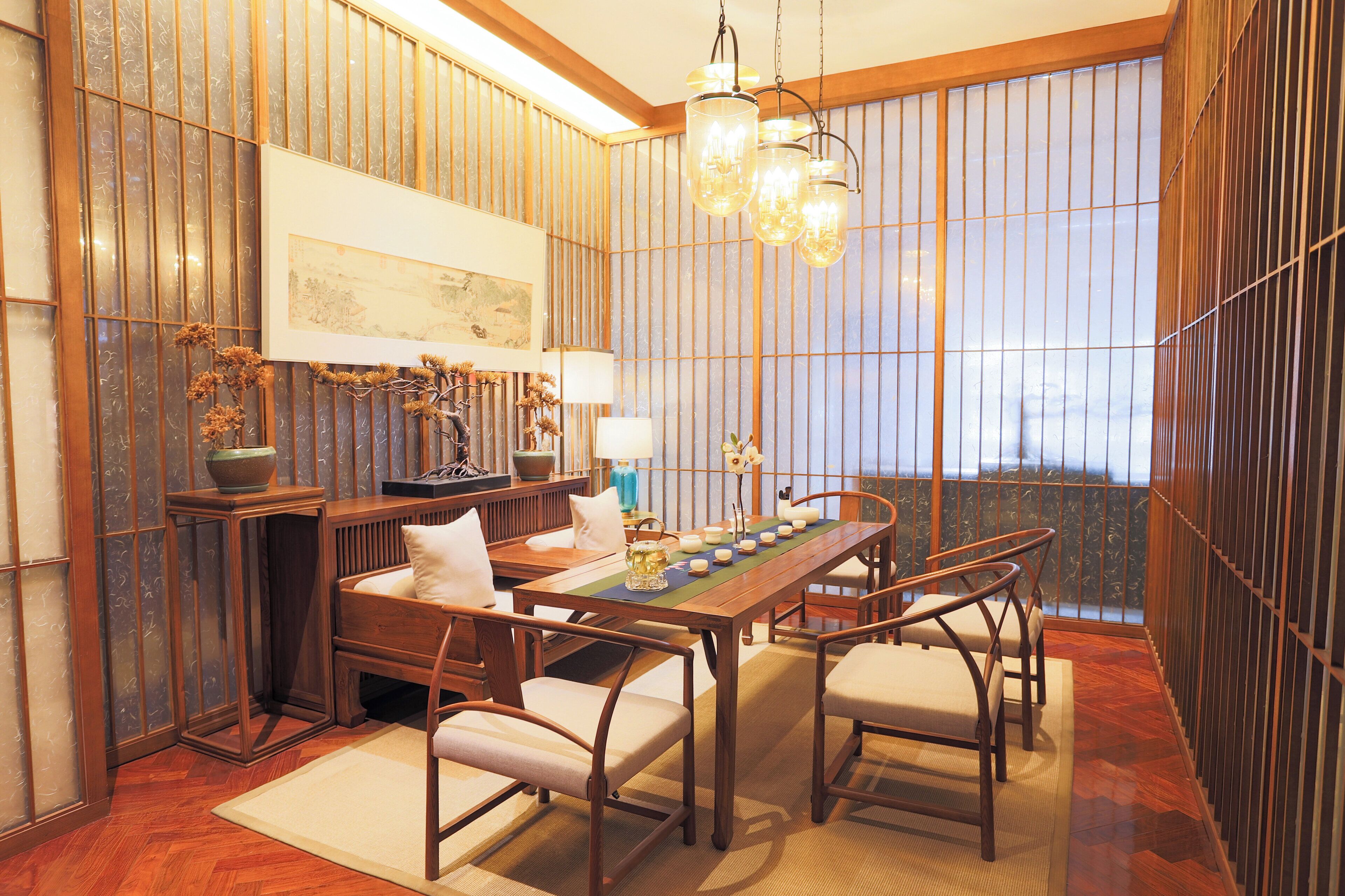 A traditional Japanese-style room with tatami flooring, a low wooden table, and shoji screens.